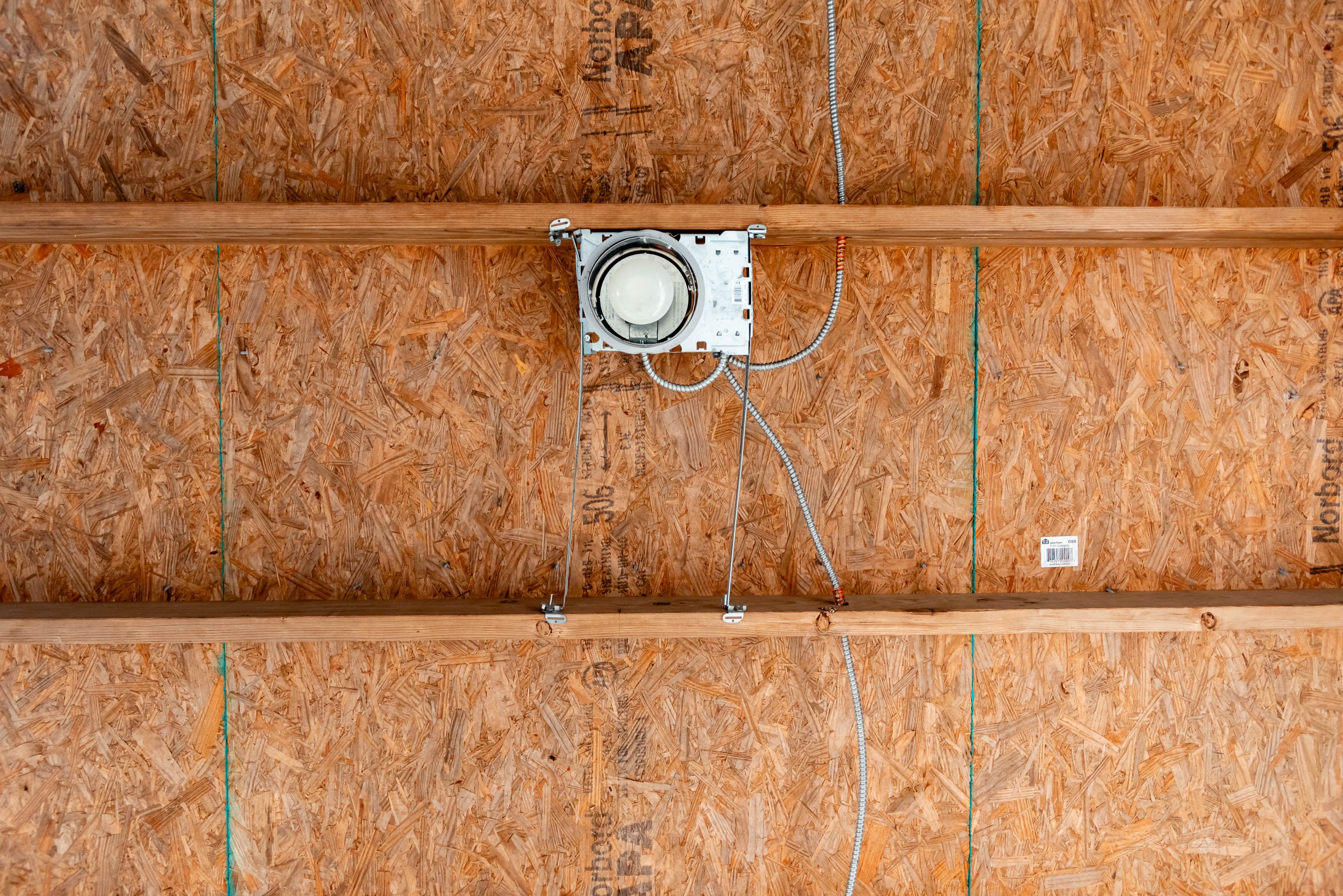 Electrical fixture rough-in on OSB ceiling — Casta Energy new construction