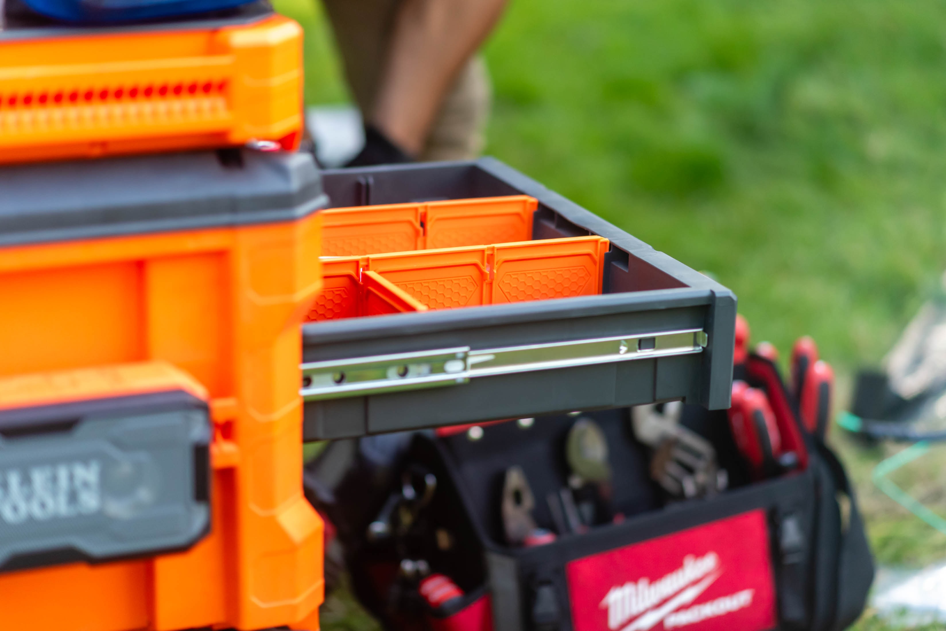 Milwaukee Packout modular toolboxes open on job site with Milwaukee tool bag — Casta Energy equipment
