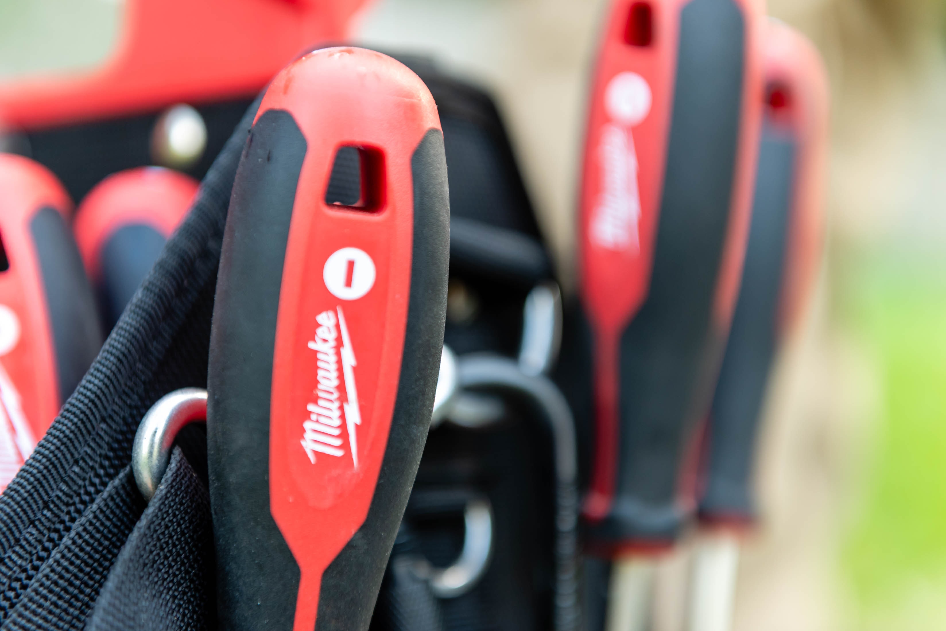 Milwaukee tools in tool belt — Casta Energy uses professional-grade equipment