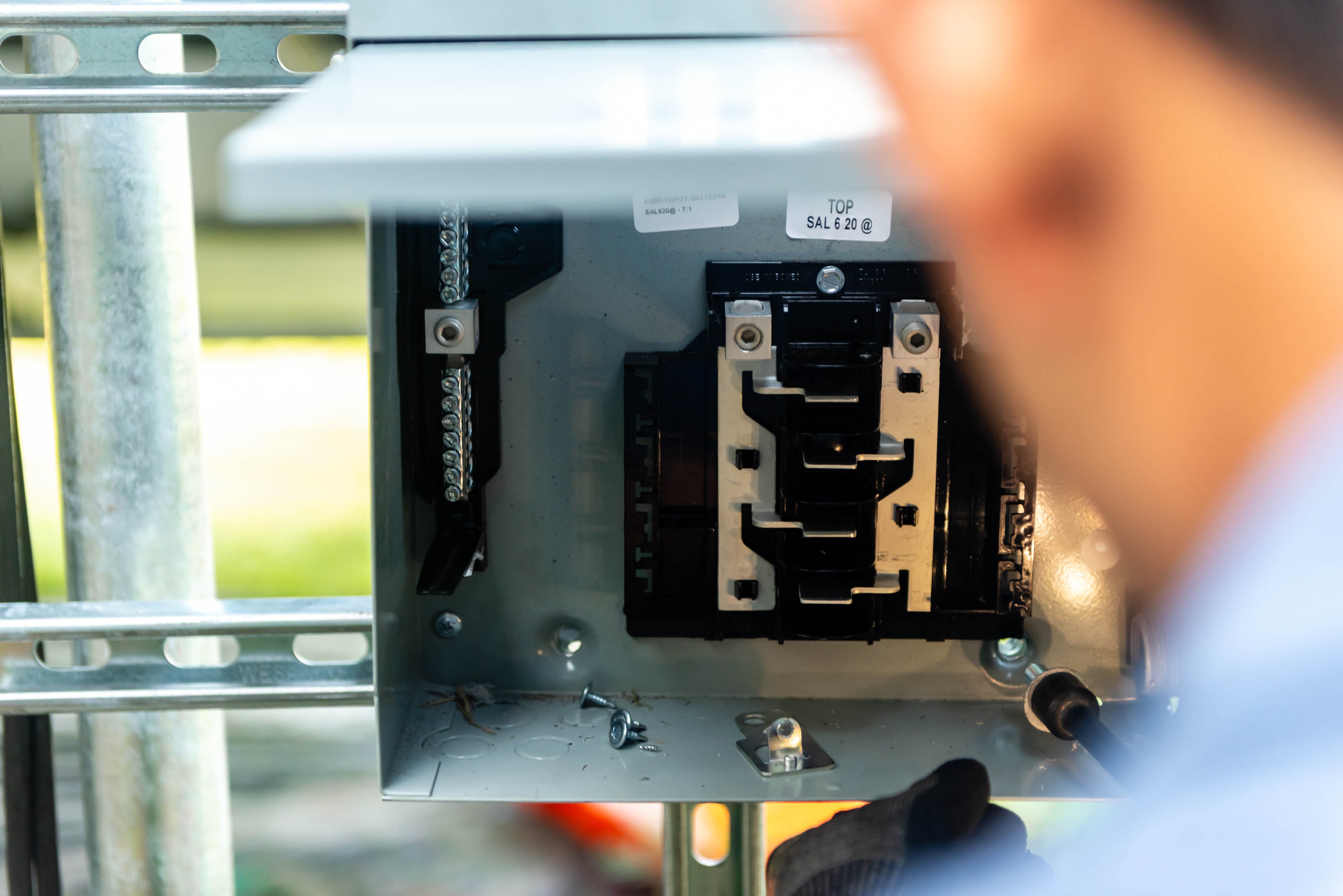 Close-up of solar disconnect breaker internals on ground-mount racking — Casta Energy